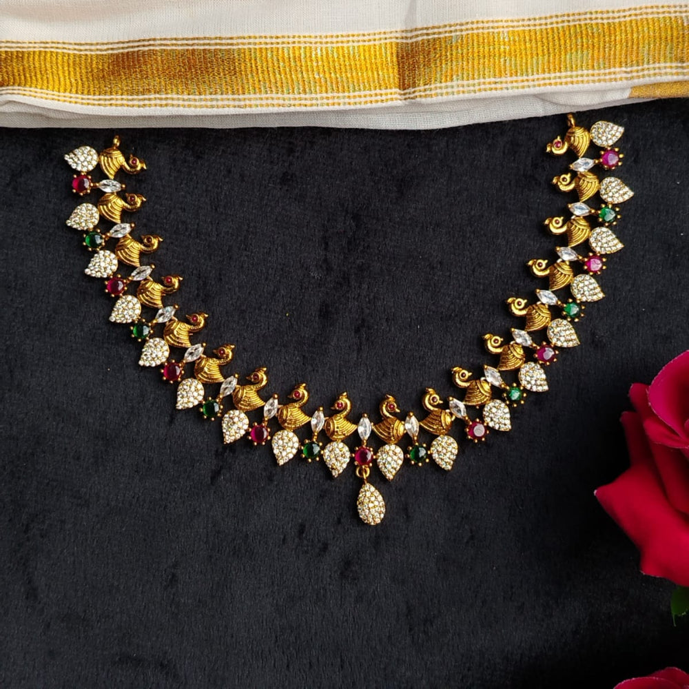 Gold necklace with gemstones on a black background