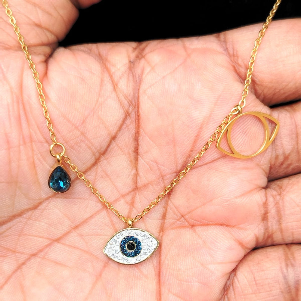 Evil Eye Blue Crystal Charm Pendant Held in Hand
