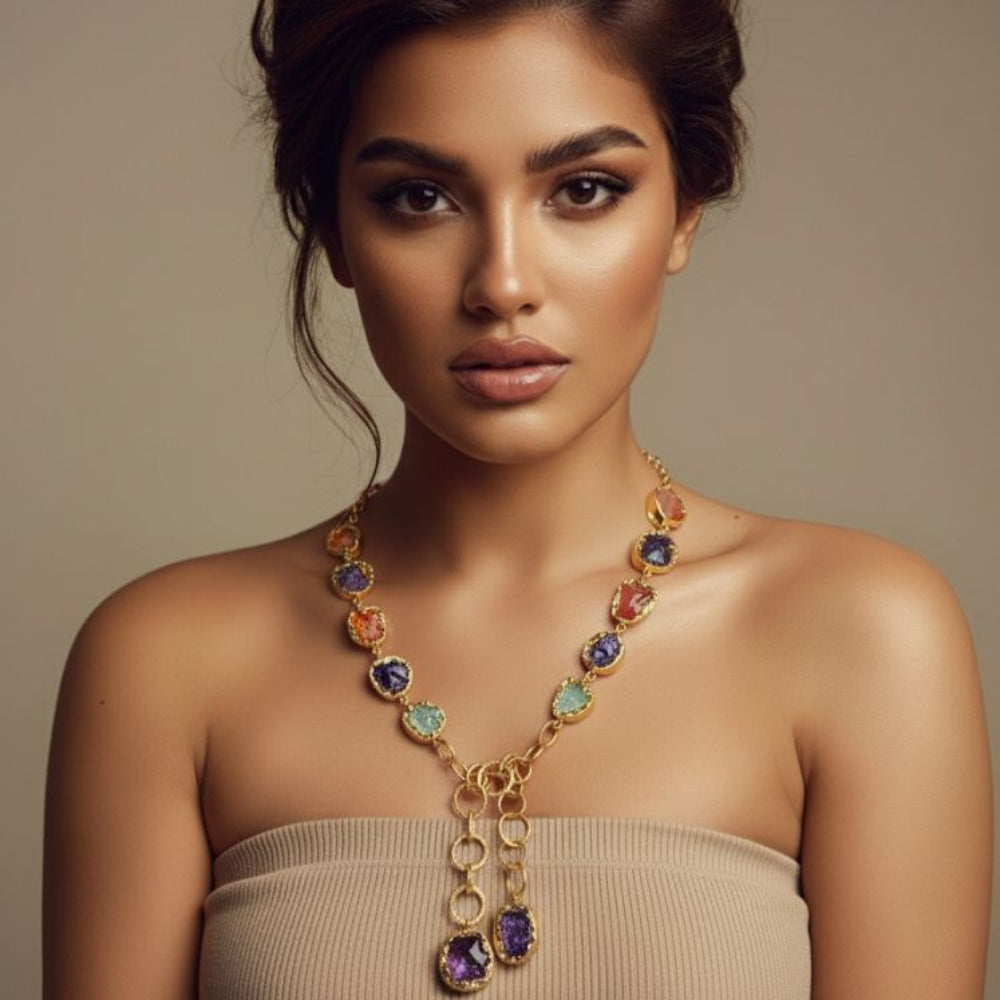 Woman wearing a colorful necklace against a neutral background