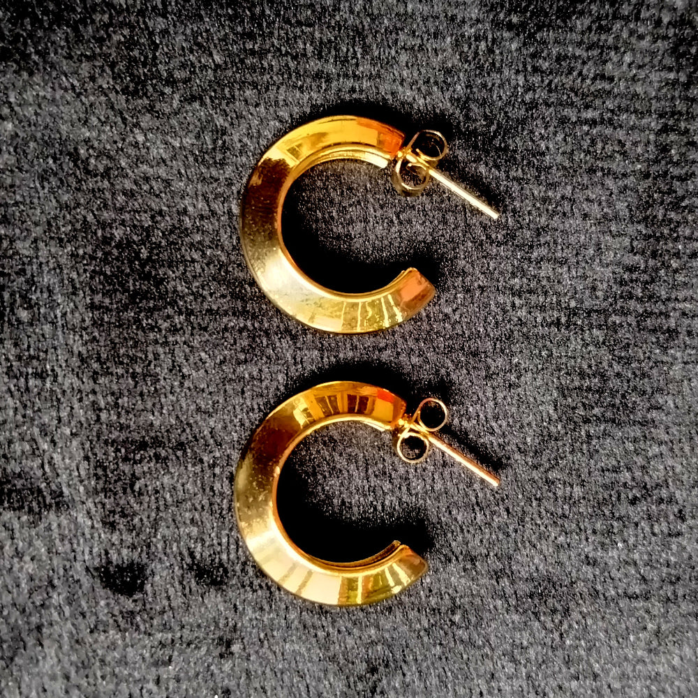 A pair of Anti-tarnish Hoop Earrings on a Velvet Black Surface
