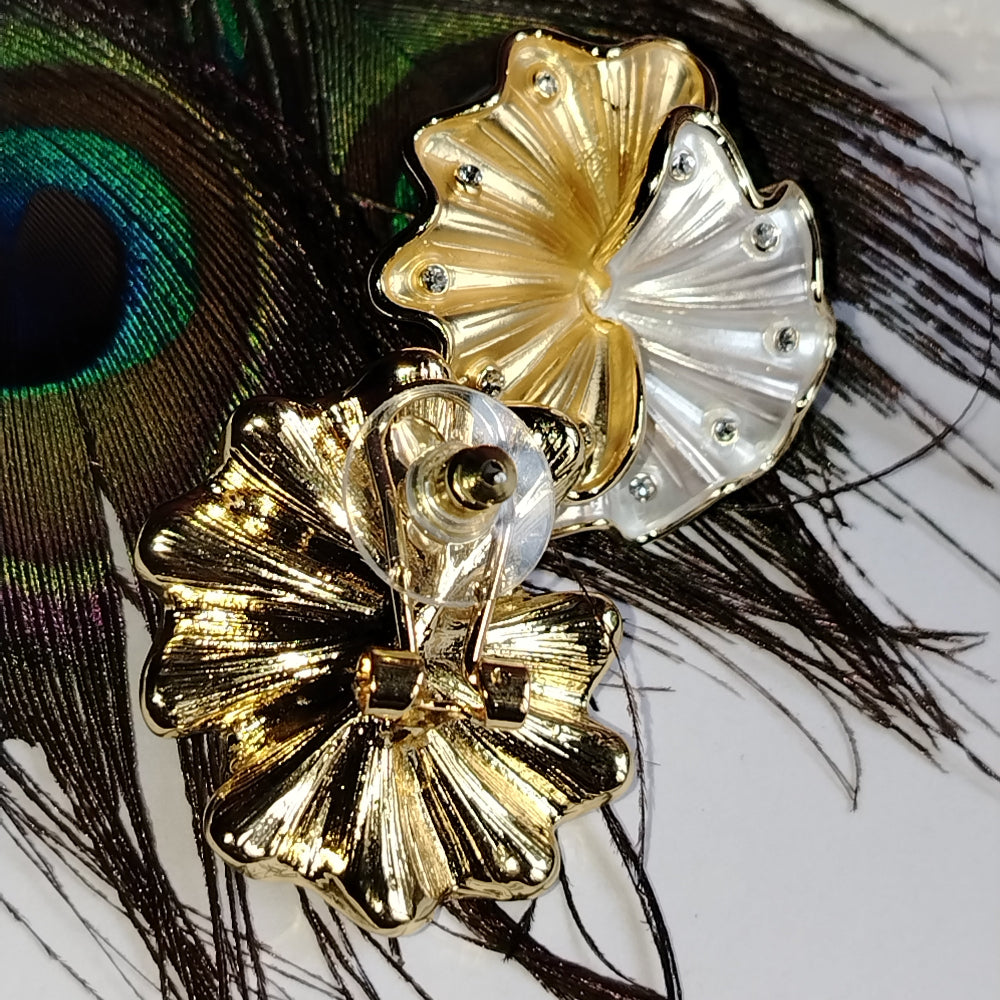 Front and Back View of Dual Toned Flower Earrings on a Peacock Feather