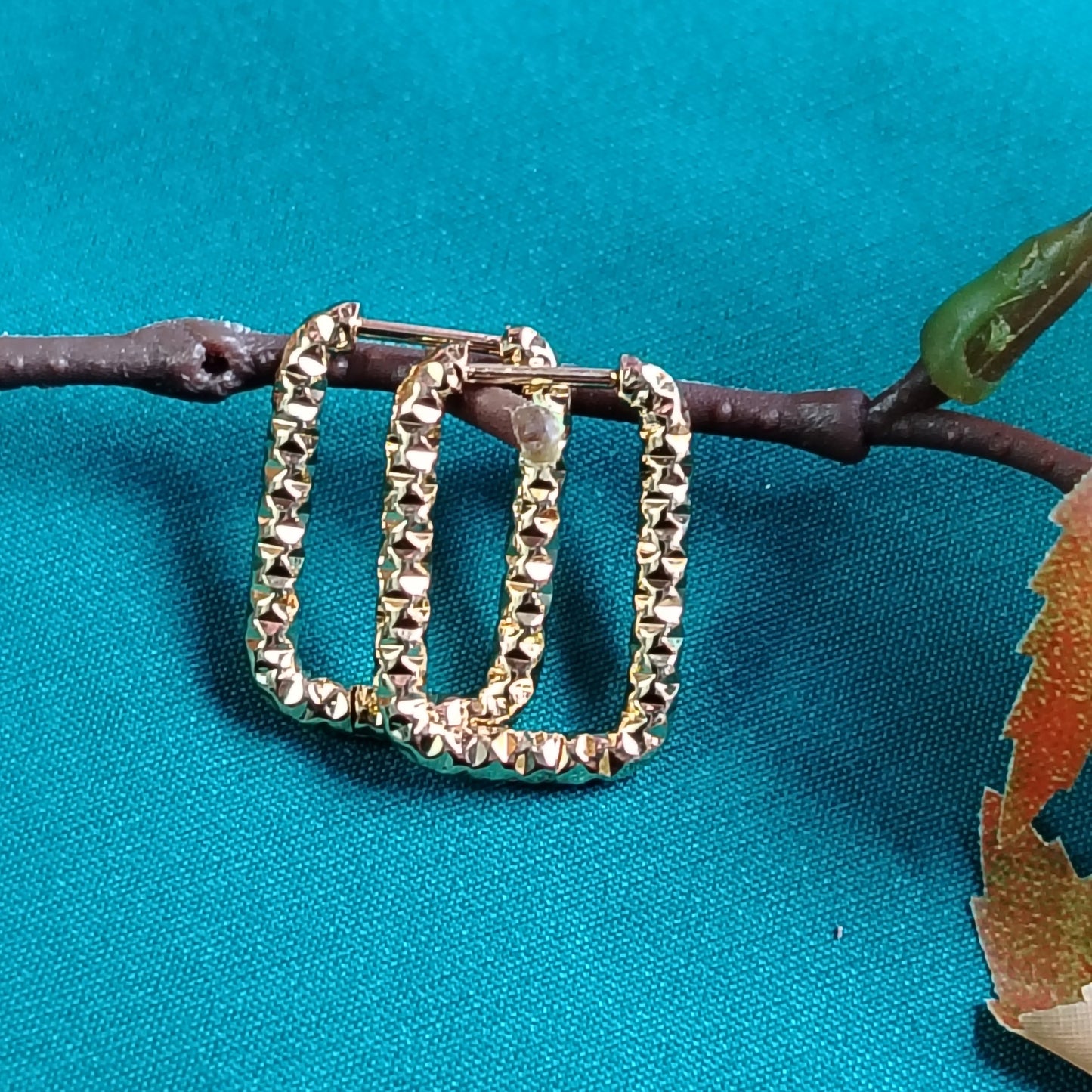 Carved Square Hoops on Blue Backdrop