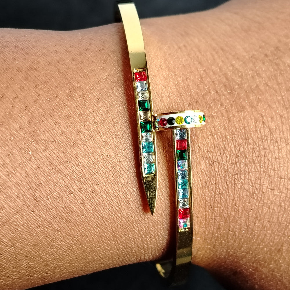 Brand Inspired Nail Bracelet on Model's Hand