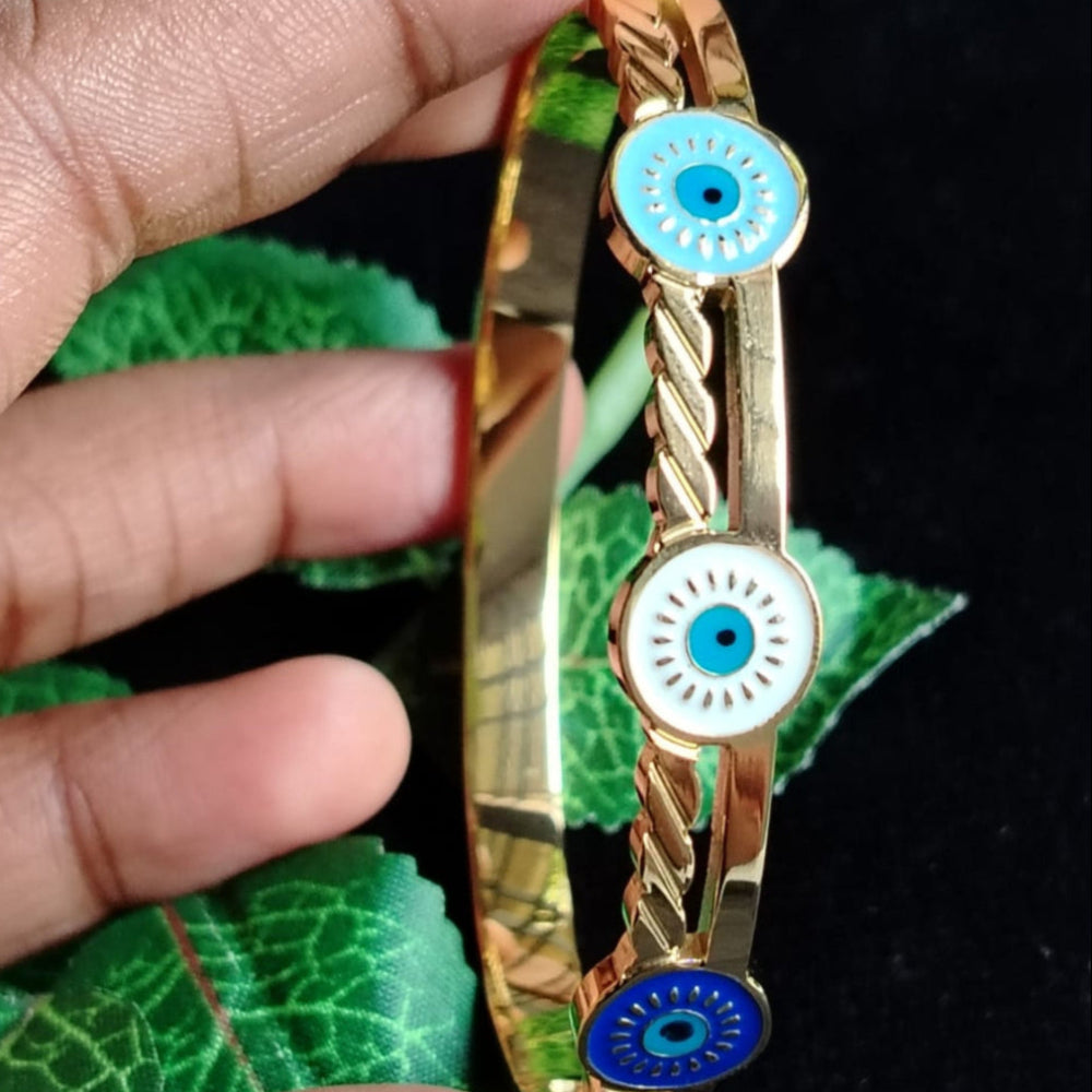 Model Holding Triple Evil Eye Bracelet