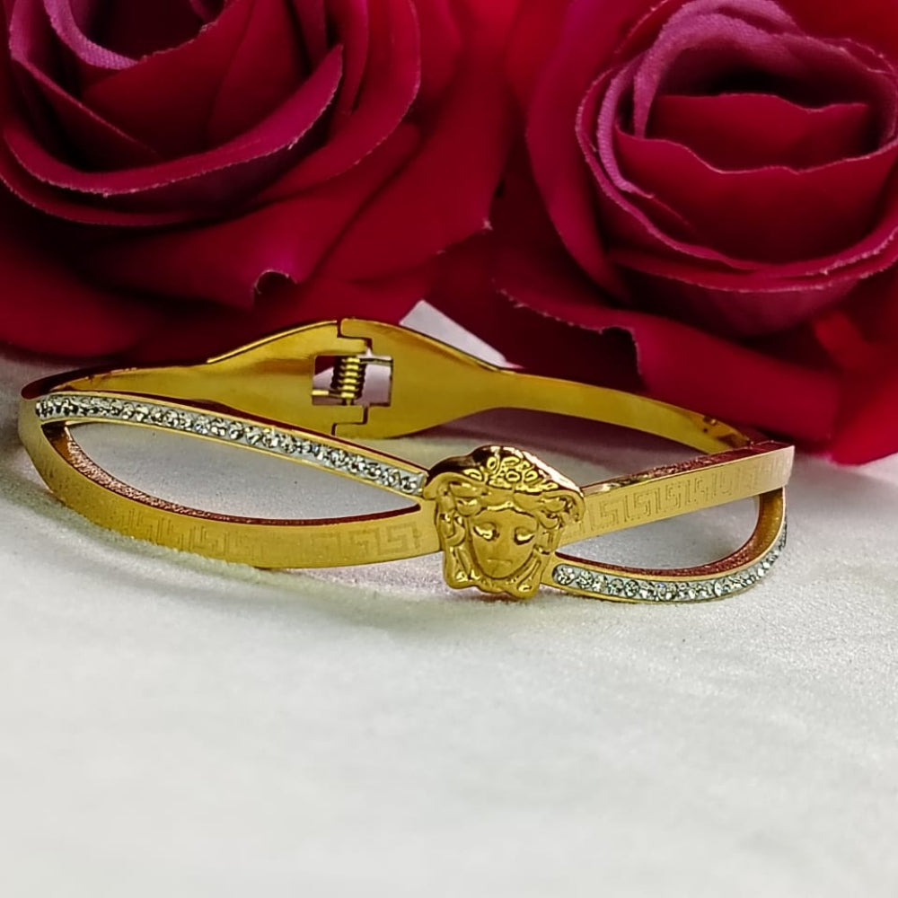 Golden Bracelet with Brand Logo and Roses behind