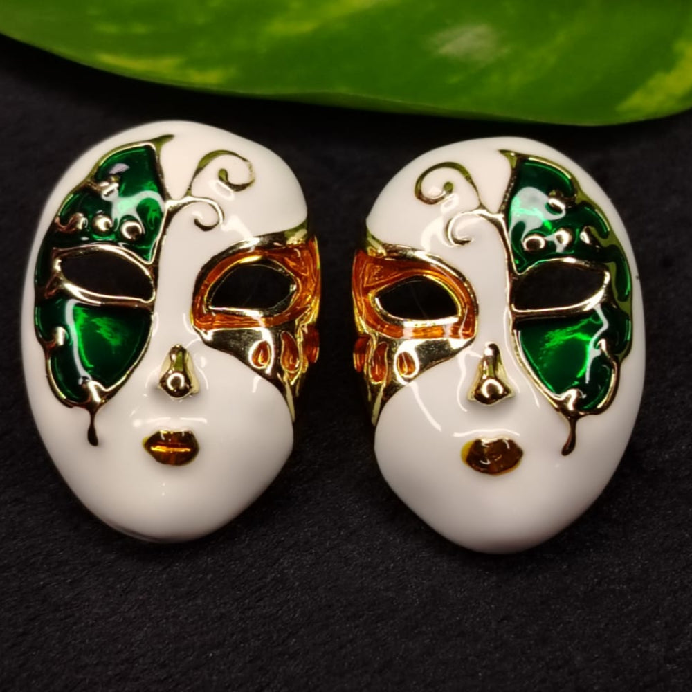 Pair of white Mask-shaped Earrings with Green, Red, and Gold Accents on a Dark Background.