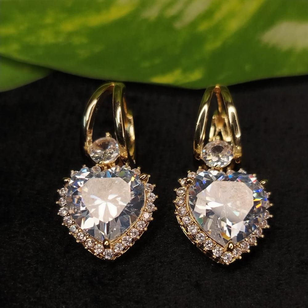 Ant-tarnish Hoops with Large Heart Shaped American Diamond on Dark Background with Leaves