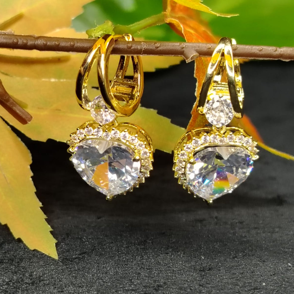 Golden Hoops with Heart-Shaped American Diamond Drops on an Autumn Leaves Branch