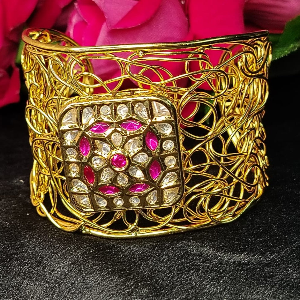 Filigree Golden Bracelet with Pink Stone against Roses