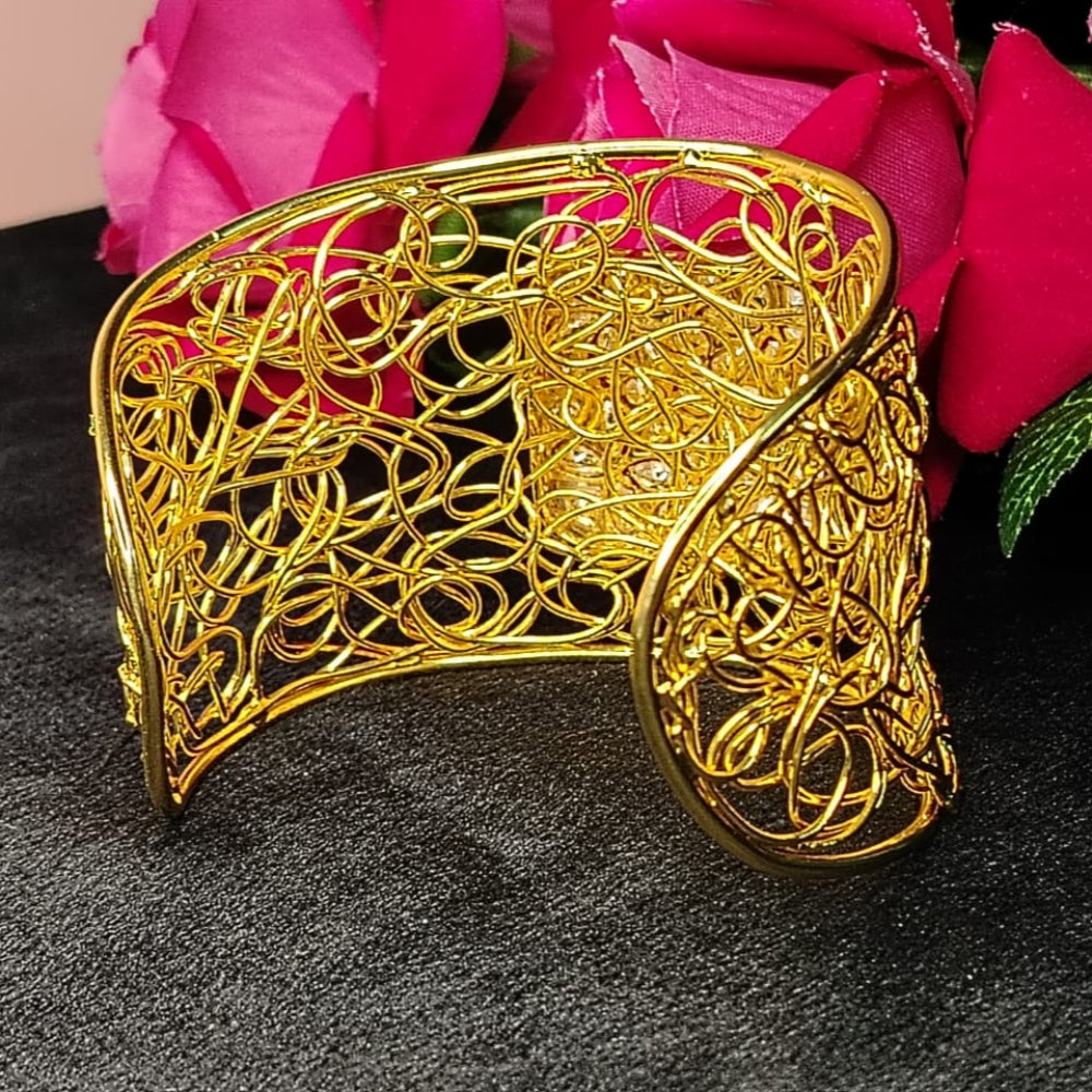 Golden FIligree Bracelt on DArk Surface with Roses