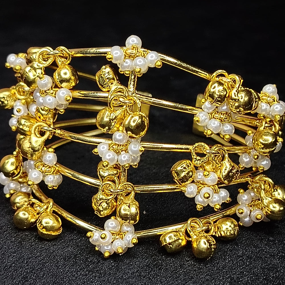 Bracelet with Golden and Pearl Beads on a Black Surface
