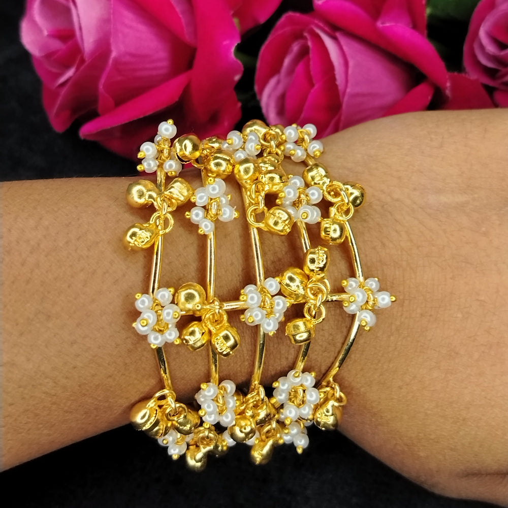 Golden Bracelet with Gold and Peparl Beads on a Wrist