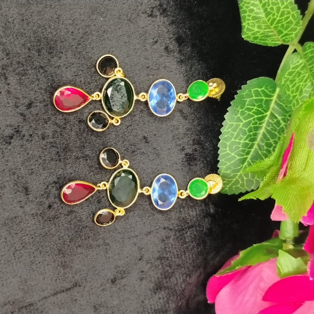 Pair of Colorful Crystal Dangler Earrings on a Black Surface against Roses