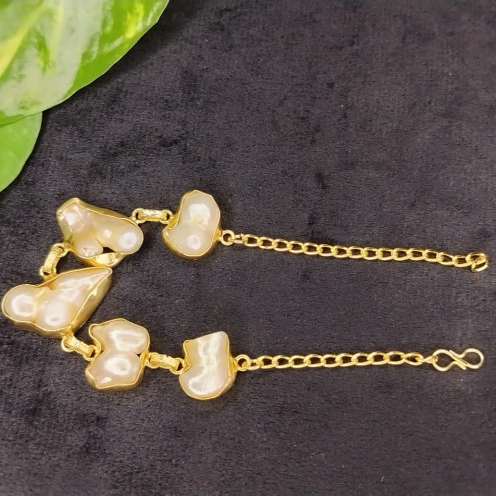 Natural Pearl Bracelet on Dark Background with Leaves