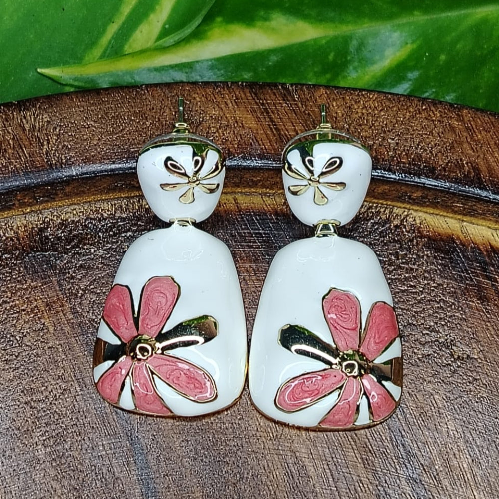 Pair of Pink FLoral Earrings on Wooden Background