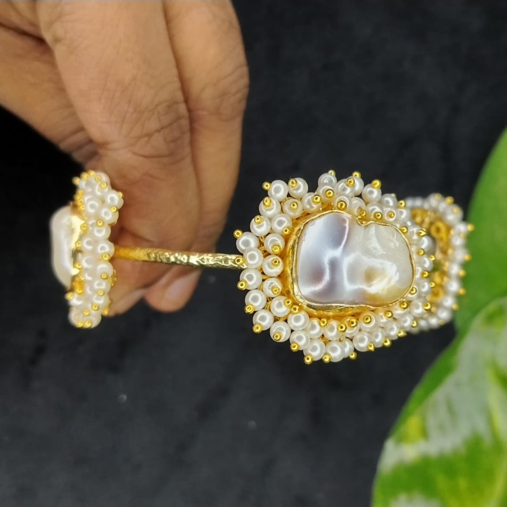Golden Natural Pearl Bracelet Held in Hands