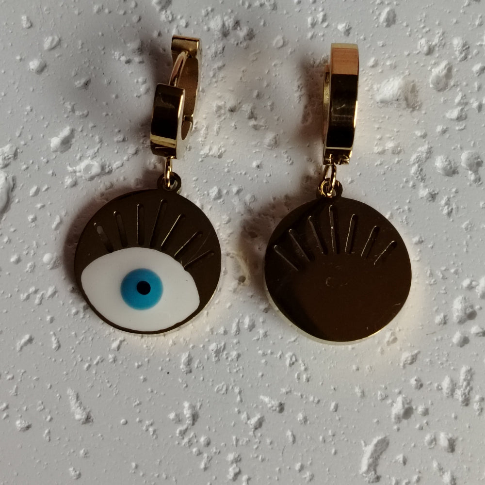 Front and Back View of Evil Eye Earrings on a Textured White Background