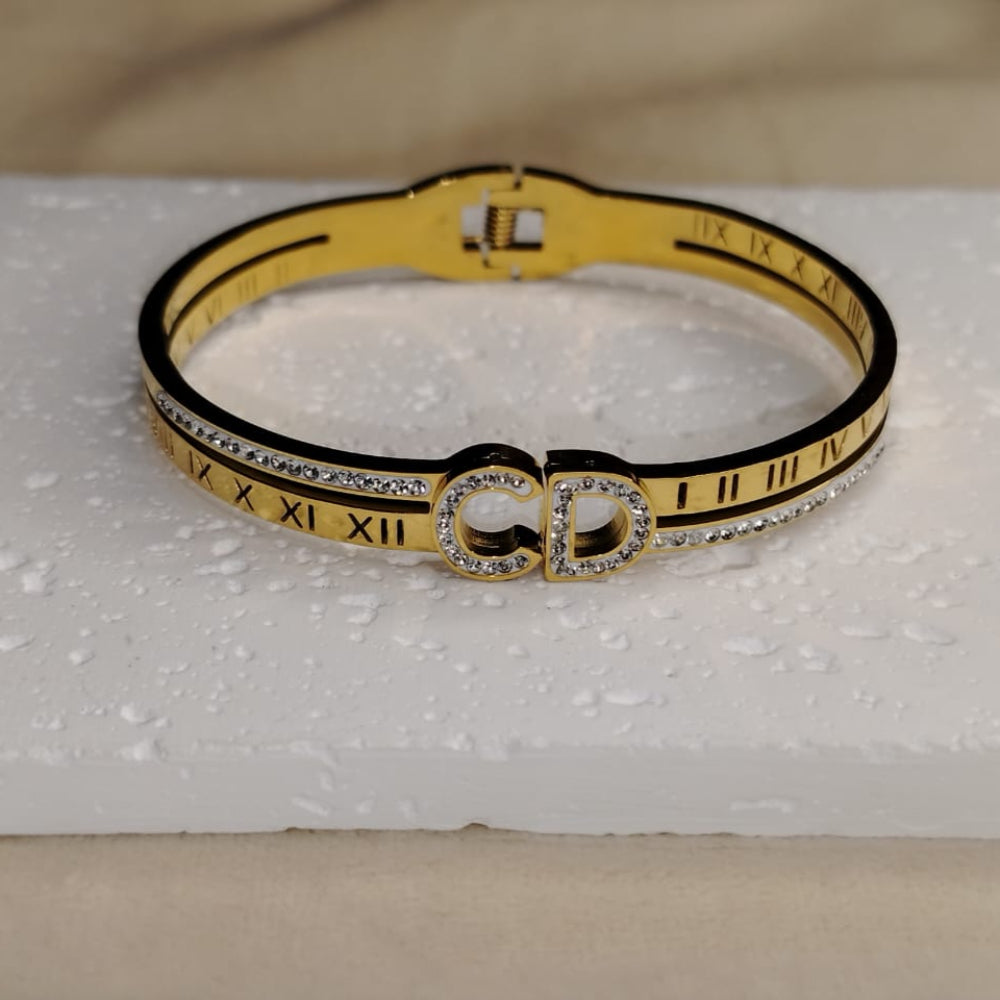 Golden Bracelet with CHristian Dior Logo Studded with American Diamonds