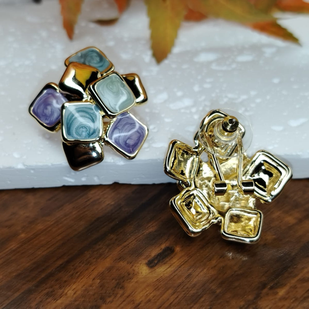 Back View of Geometric Enamel Earrings with a Latch-back Closure on a Wooden Background