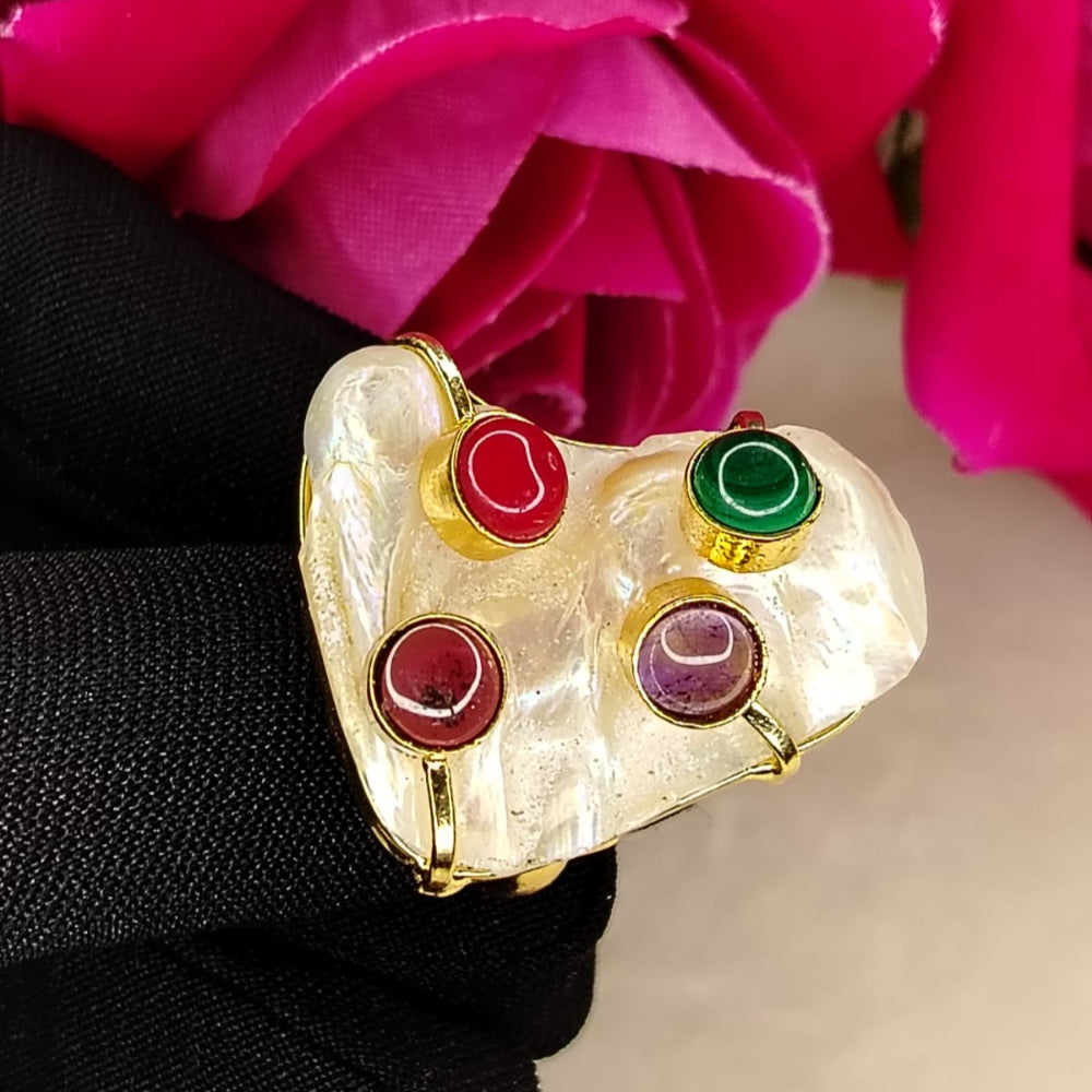 Golden Natural Pearl Ring With Semi-precious Stones Embedded held by a Black Gloved Hand