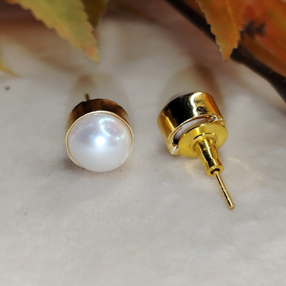 Ntural Pearl Earrings with Push Back Closure on Beige Background