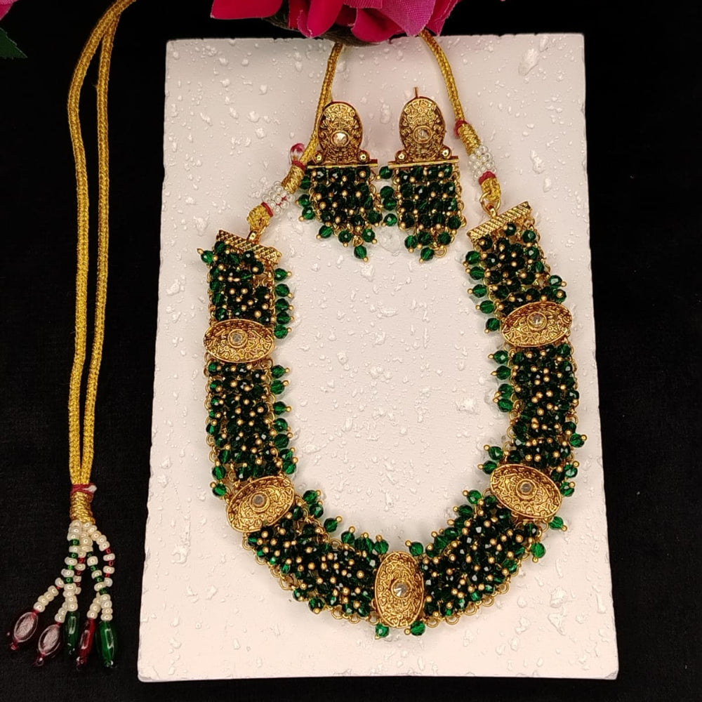 Handworked Handbeaded Necklace and Earrings Set on White Surface