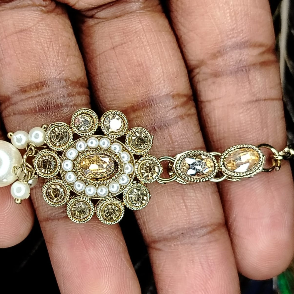 Floral Kundan Maati with Pearls Held by Hand