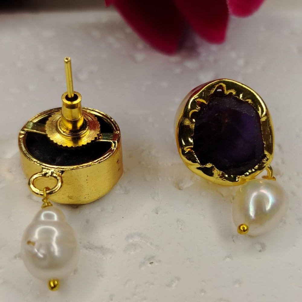 Front and back View of Golden earrings with Amethyst and pearl drops on a light background