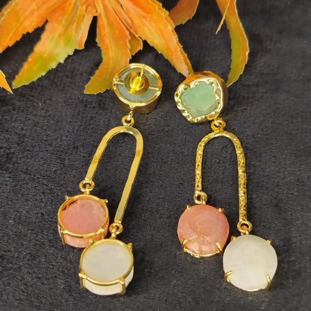 Front and Back View of golden earrings with colorful stones on a dark background