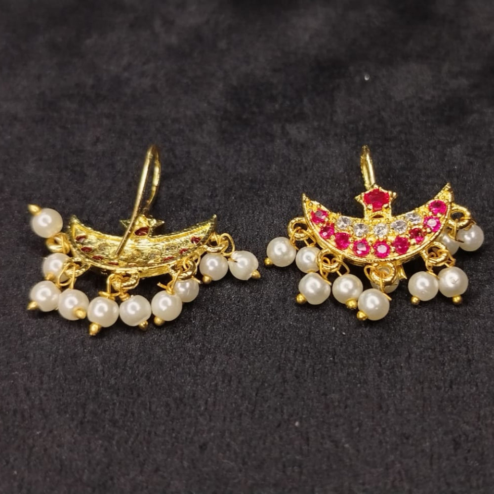 Pair of Moon ear cuffs with pearl beads and gemstones on a dark background