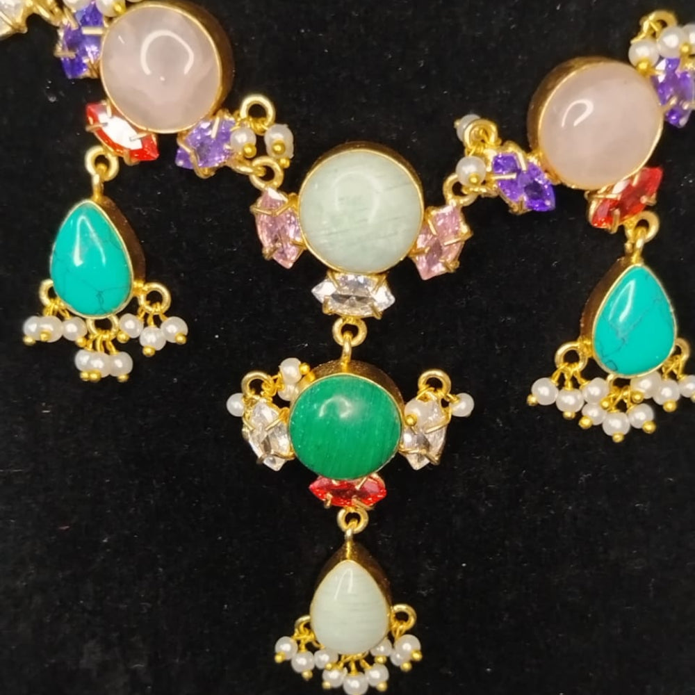 Jewelry set with colorful gemstones on a black background