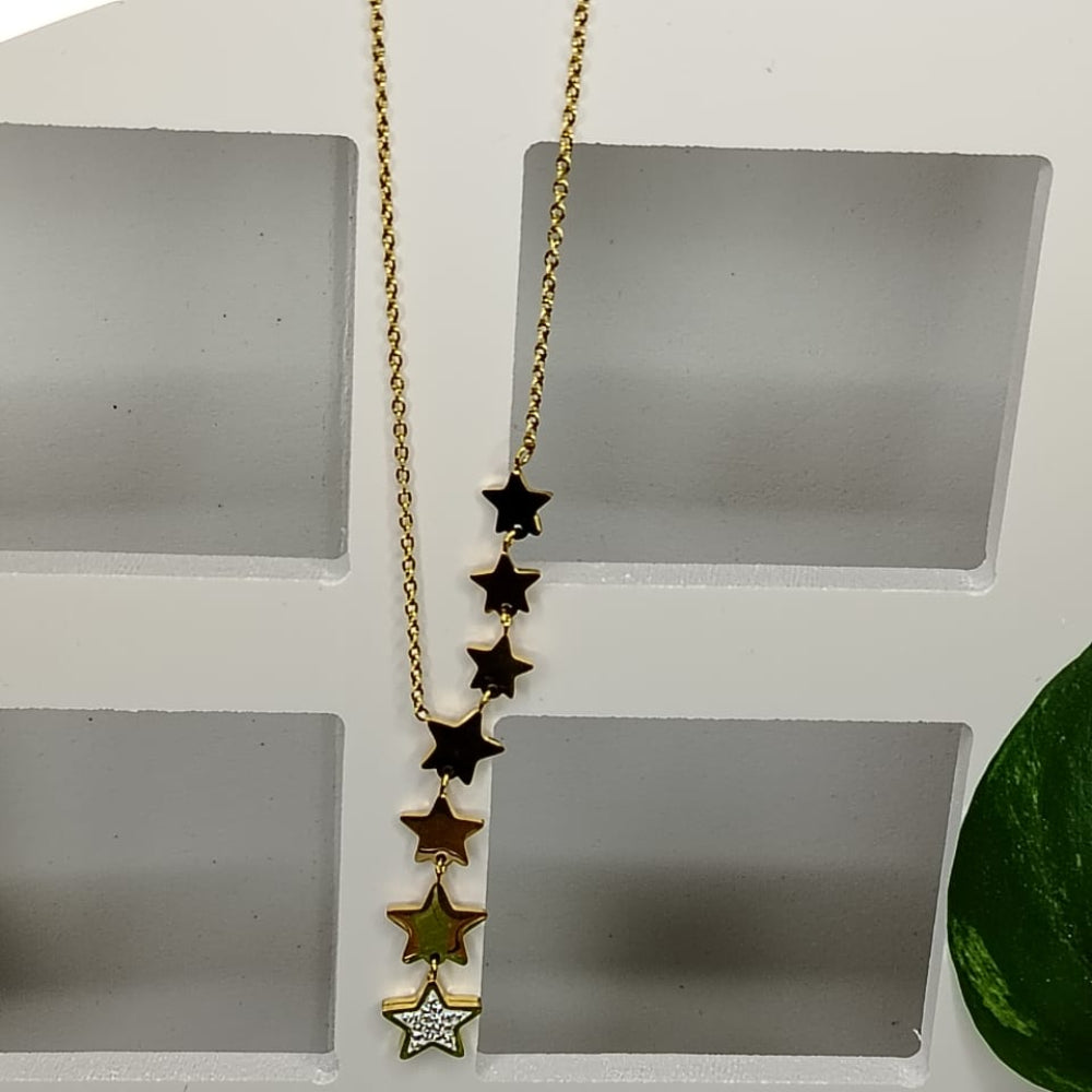 Golden anti-tarnish necklace with star pendants on a white stand