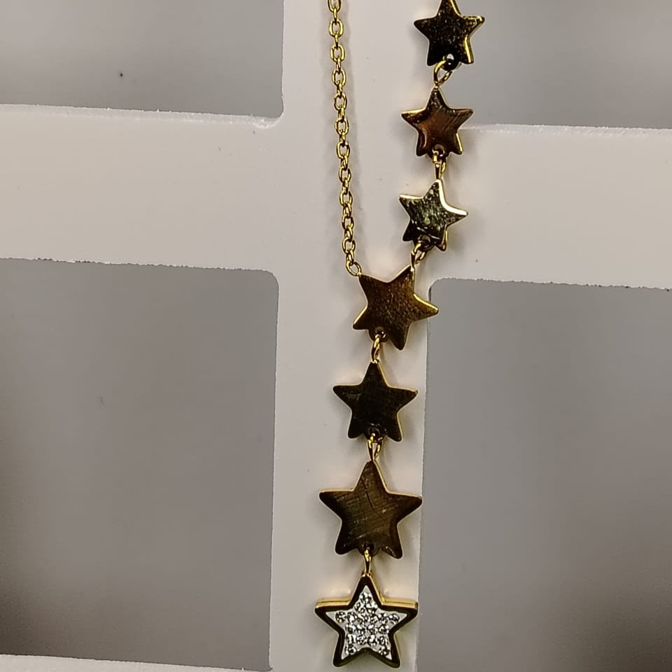 Anti-tarnish Necklace with star-shaped pendants on a gray background