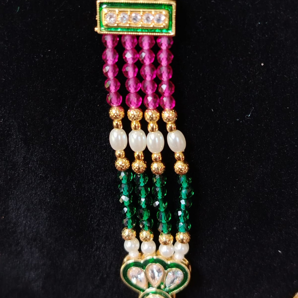 Decorative necklace with multicolored beads and gold accents on a black background