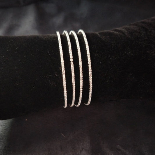 Set of 4 Rhodium Polish AD Bangles on Velvet Fabric