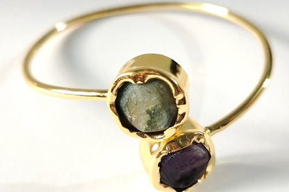Golden Bracelet with Amethyst and Aventurine on a White background