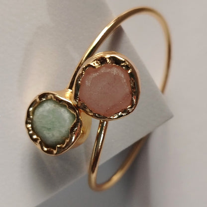 Golden Bracelet with Pink and Mint  Natural Stones on an Off-white Background