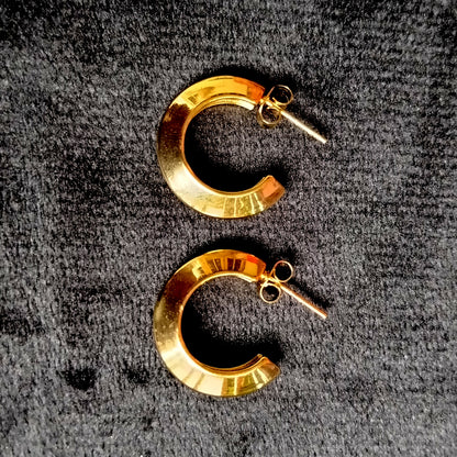 A pair of Anti-tarnish Hoop Earrings on a Velvet Black Surface