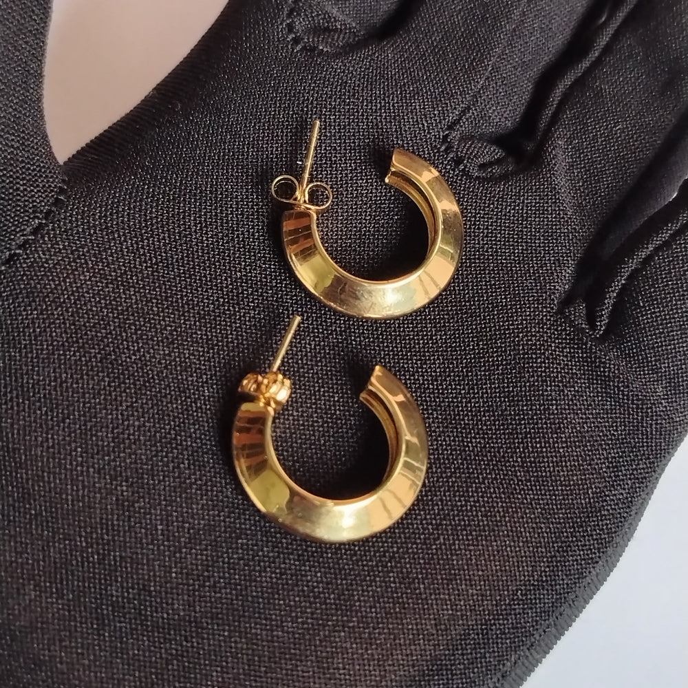Anti-tarnish Golden Hoop Earrings on a Black Glove