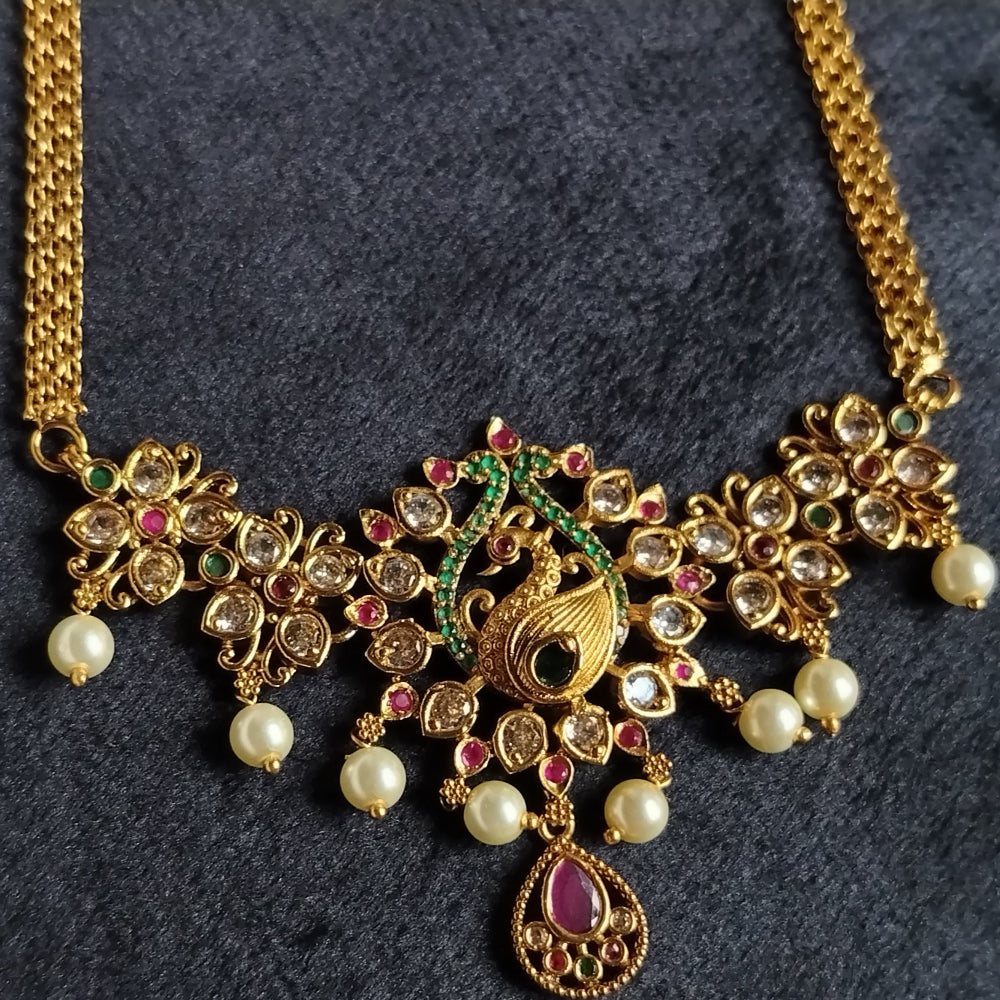 Peacock Pendant WIth Ruby Drop and Flower against White Fabric with Golden Kasavu