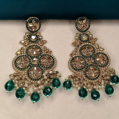 Ornate Golden and Green Earrings with Hydro Beads on a Beige Surface