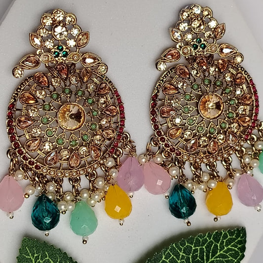Ornate Earrings with Colorful Beads and Kundan on a White surface