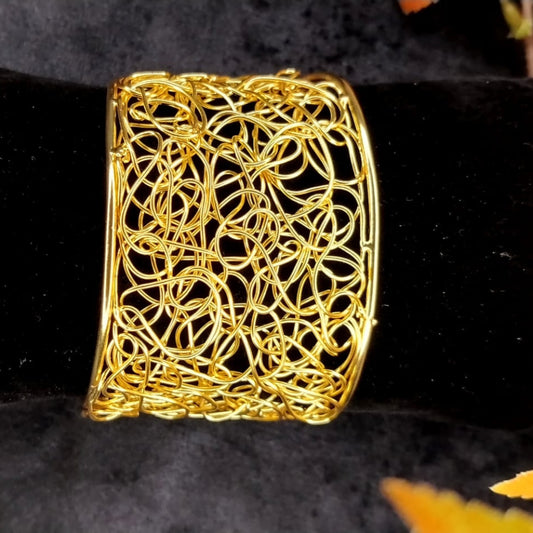 Broad Filigree Bracelet. on Black Velvet Cushion