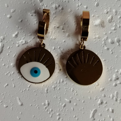 Front and Back View of Evil Eye Earrings on a Textured White Background