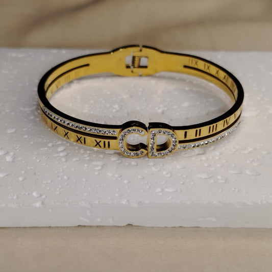 Golden Bracelet with CHristian Dior Logo Studded with American Diamonds 