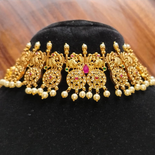 Peacock and Chakra Motif Antique Choker with Red and Green Crystals on a Dummy