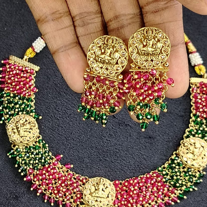 Ornate Idol Necklaceand Earrings with Hand-worked Hydro-beads Held by Hands