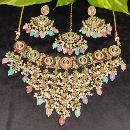 Multicolor Ornate Jewellery Set with Colorful Beads and Kundan on Black Surface