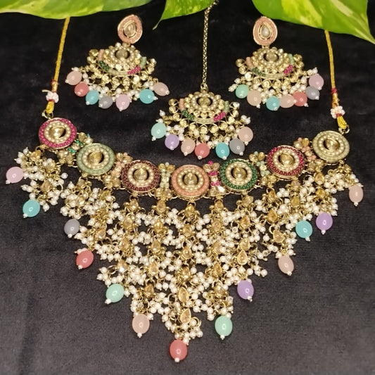Multicolor Ornate Jewellery Set with Colorful Beads and Kundan on Black Surface