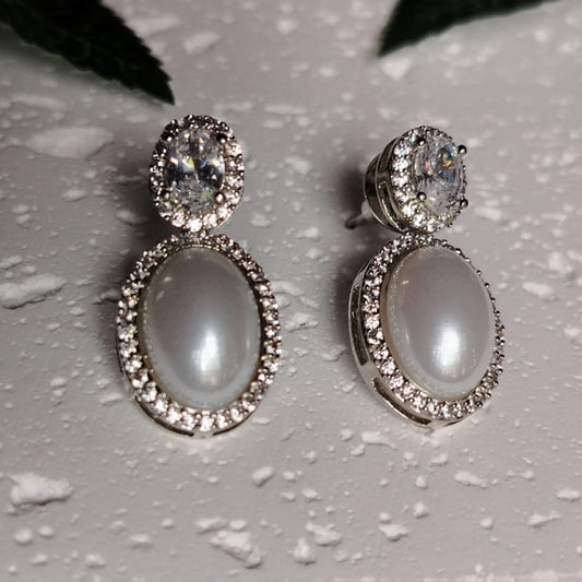 Pair of Silver polished Earrings with American Diamond and Pearl Drop